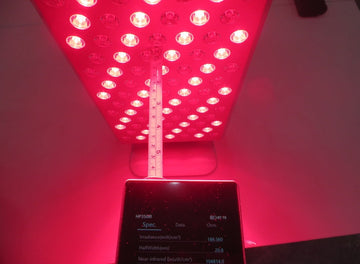 Testing irradiance of a red light therapy device using a light meter at a set distance